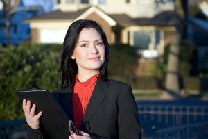 Business woman with real estate appraisal documents